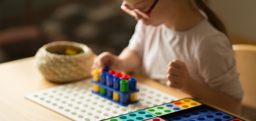 Child taking part in activities for Numicon