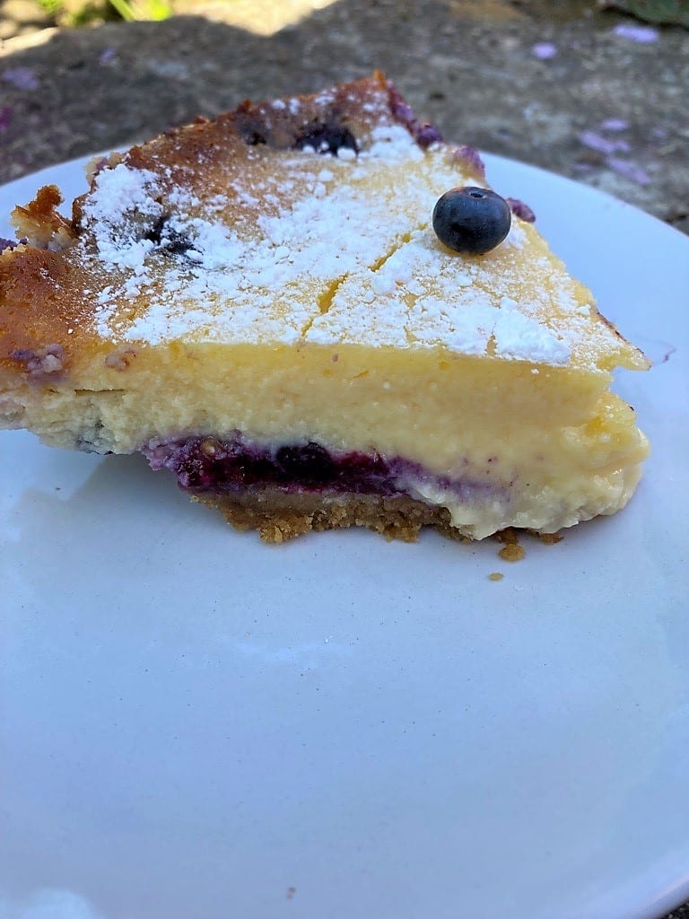 Slice of baked blueberry cheesecake