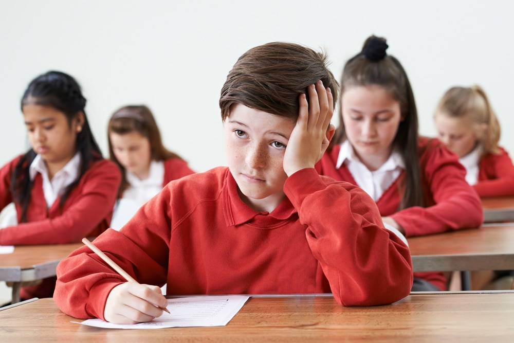 Signs of anxiety in children- anxious boy in class