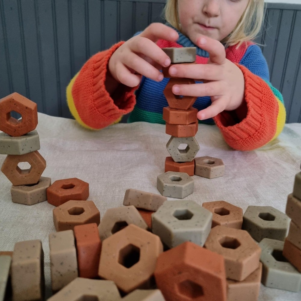 Construction play stacking blocks vertically
