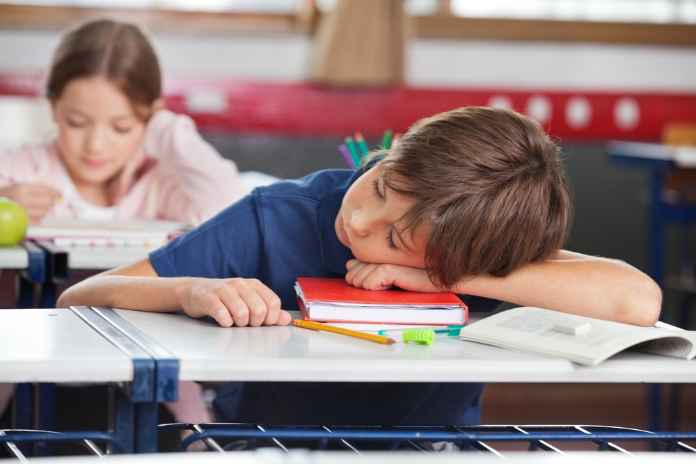 spotting depression- boy sleeping during class