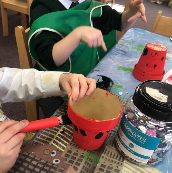 Easter plant pot ideas- Pupils painting ladybird pots