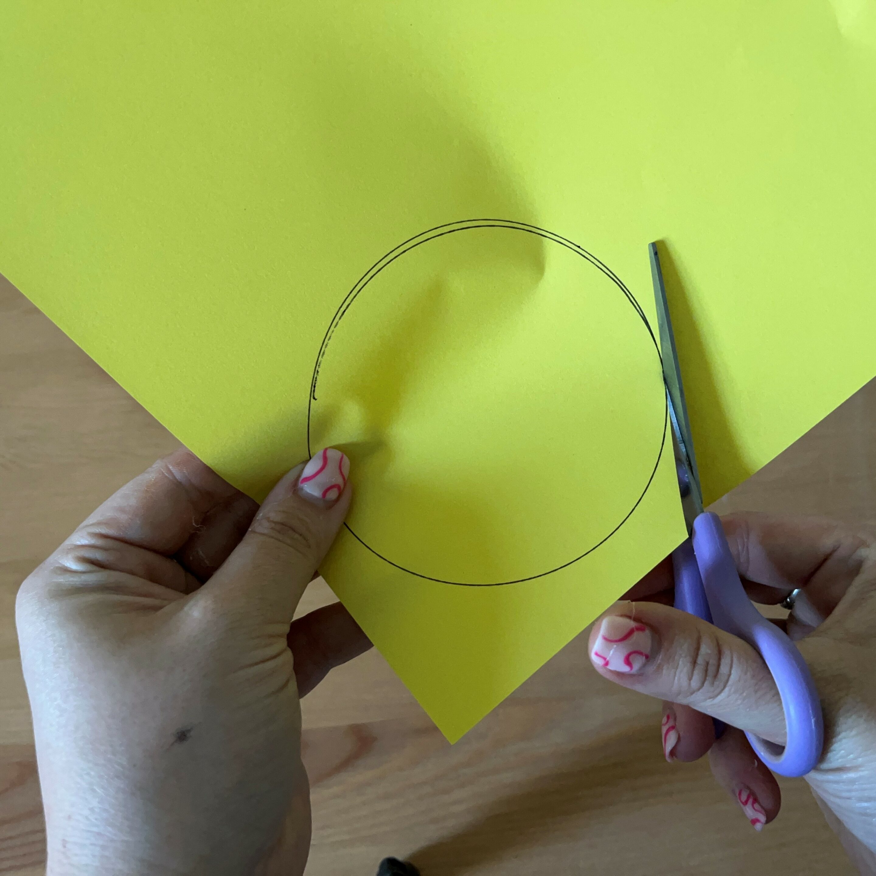 Cutting a circle for father's day rosette