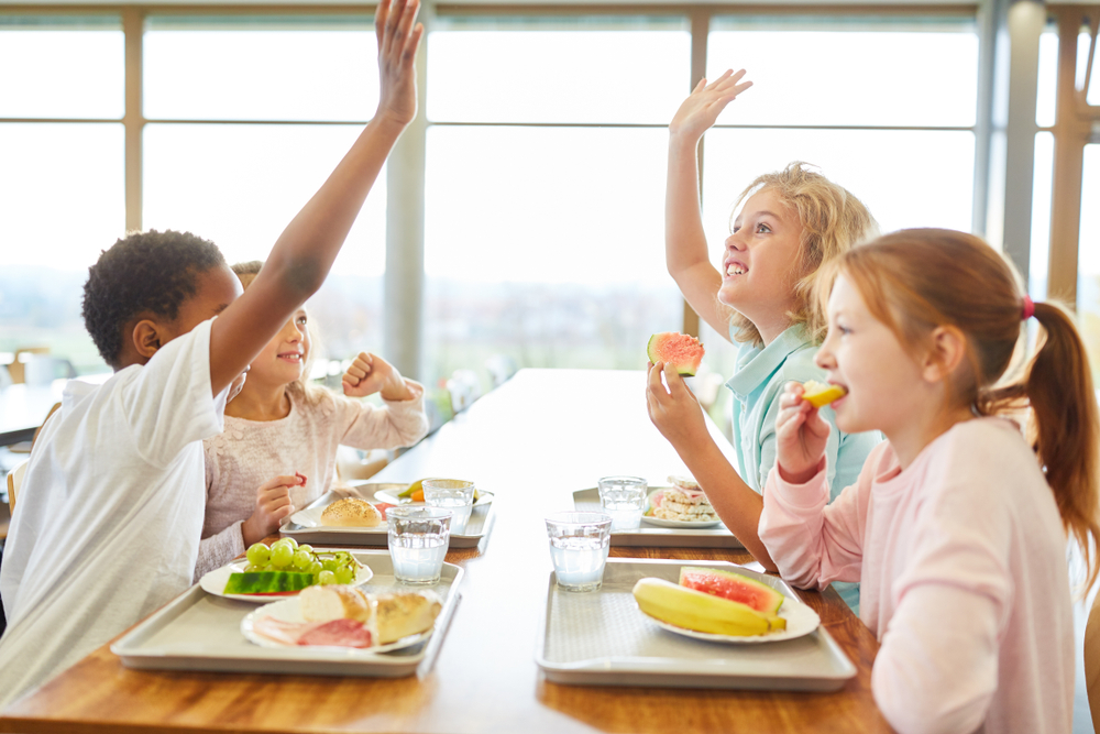 school meals- kids eating healthy breakfast having fun