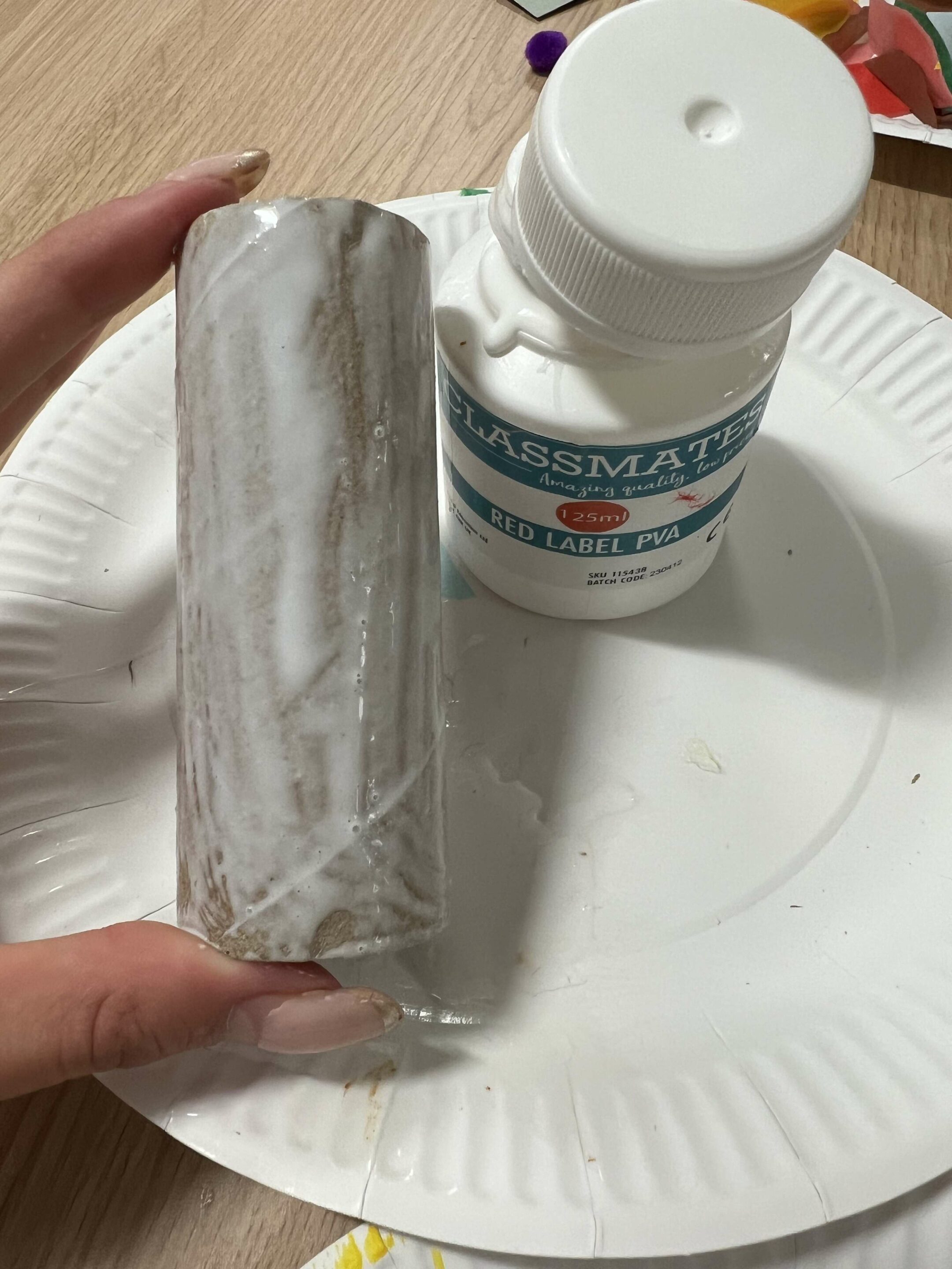 toilet roll covered in glue