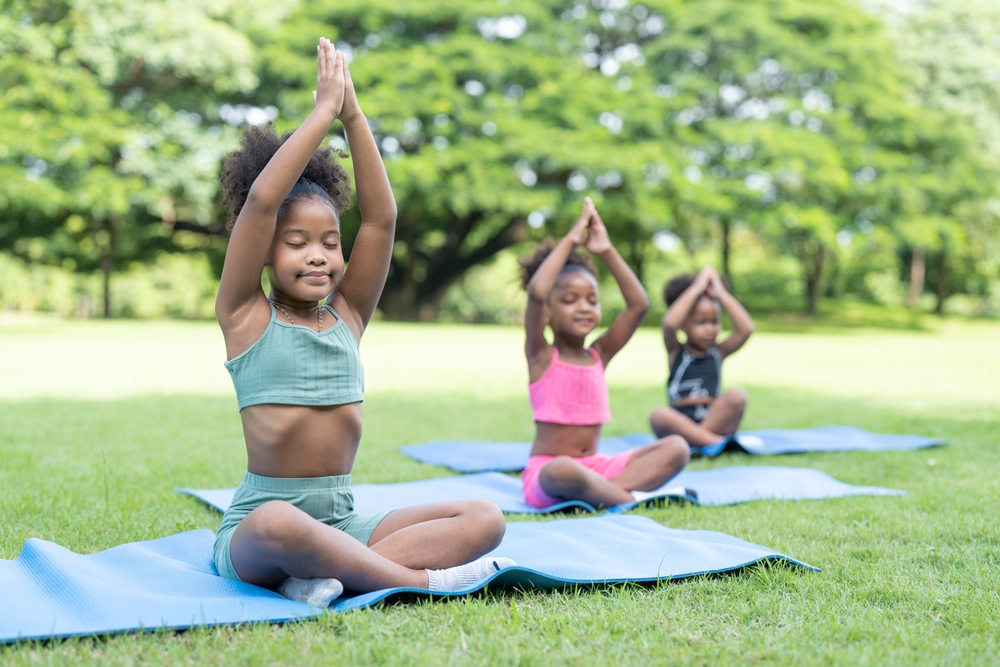 Outdoor mindfulness activities- kids doing yoga