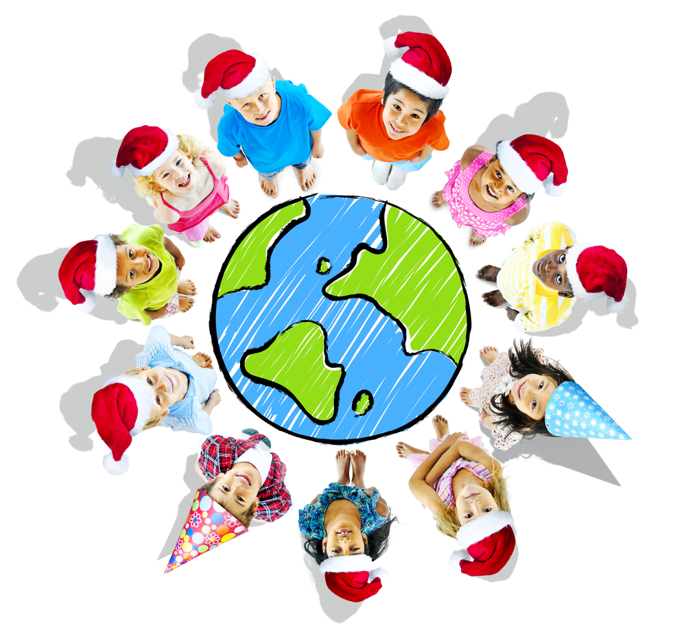 Christmas around the world- pupils in santa hats in circle around the world