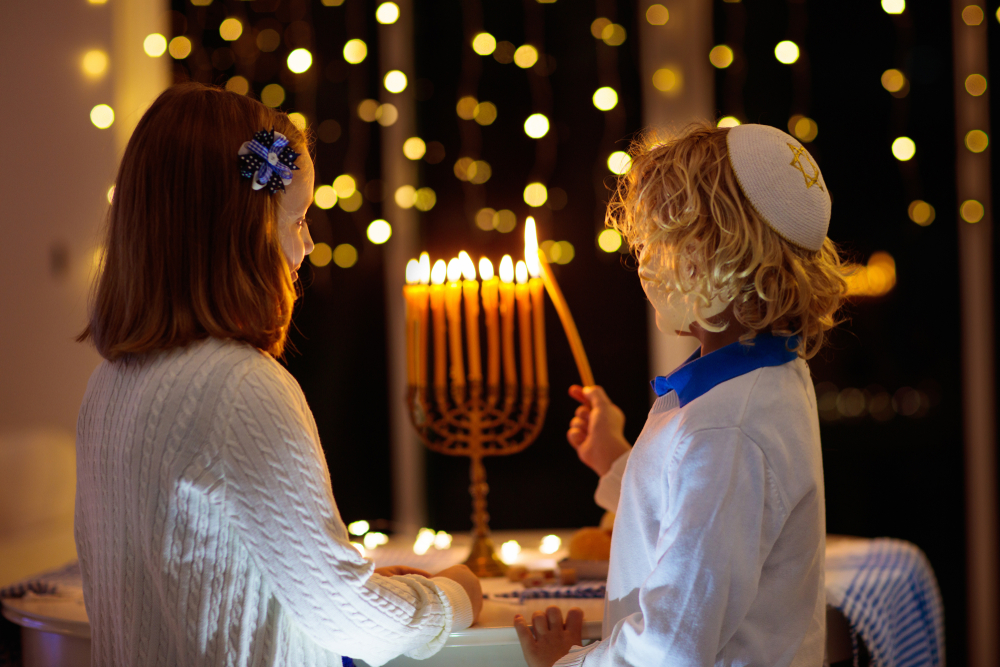 Children lighting a menorah on Hanukkah